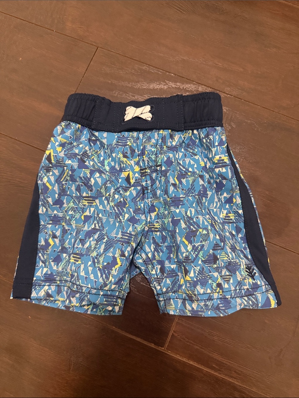 Coolibar SPF50 baby swim shorts Blue Patterned with Navy Waistband 6-12m